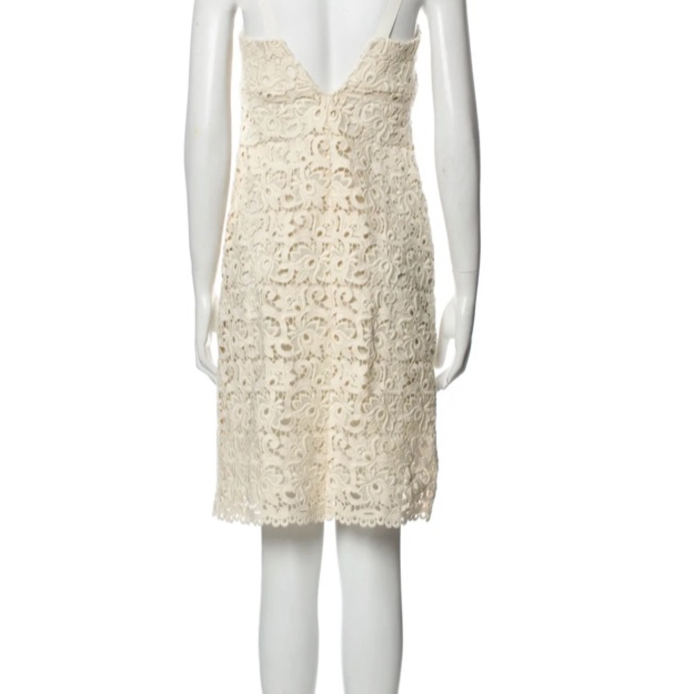 Ivory lace dress by Michael Kors is in like new condition. Size 2 - Picture 4 of 16
